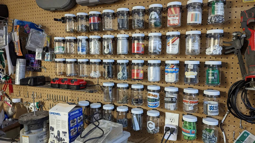 Customer garage with playwood wall using Wallwerx container organization system 