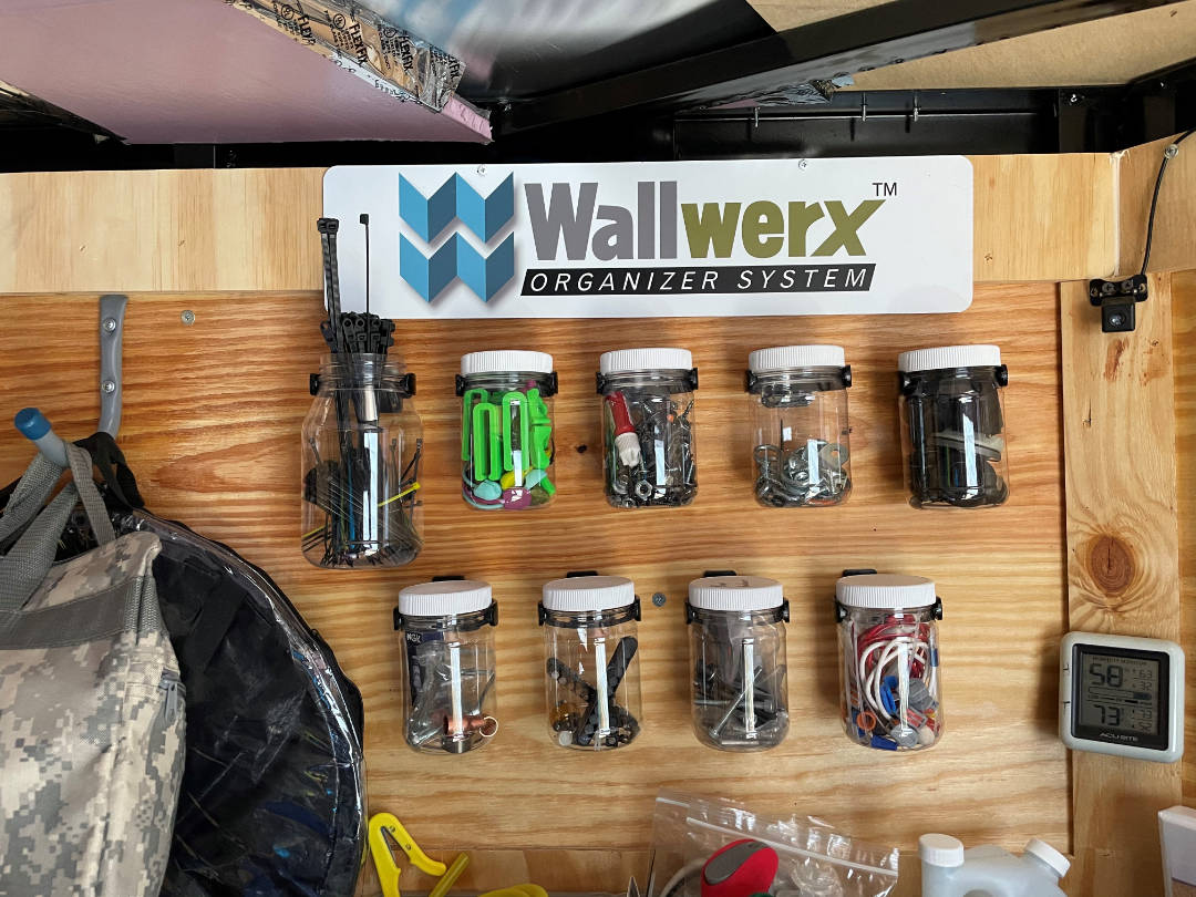 Customer garage with playwood wall using Wallwerx container organization system 